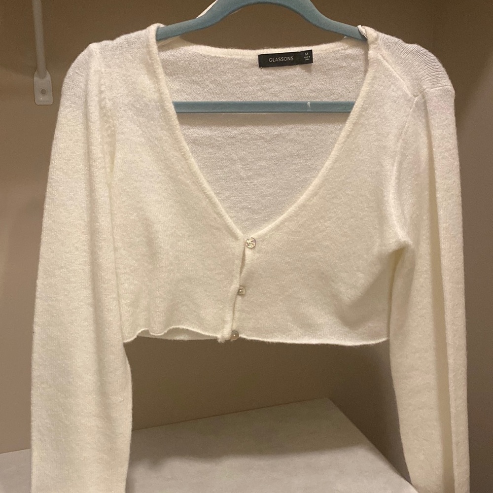 Cropped white sweater with pearl button front